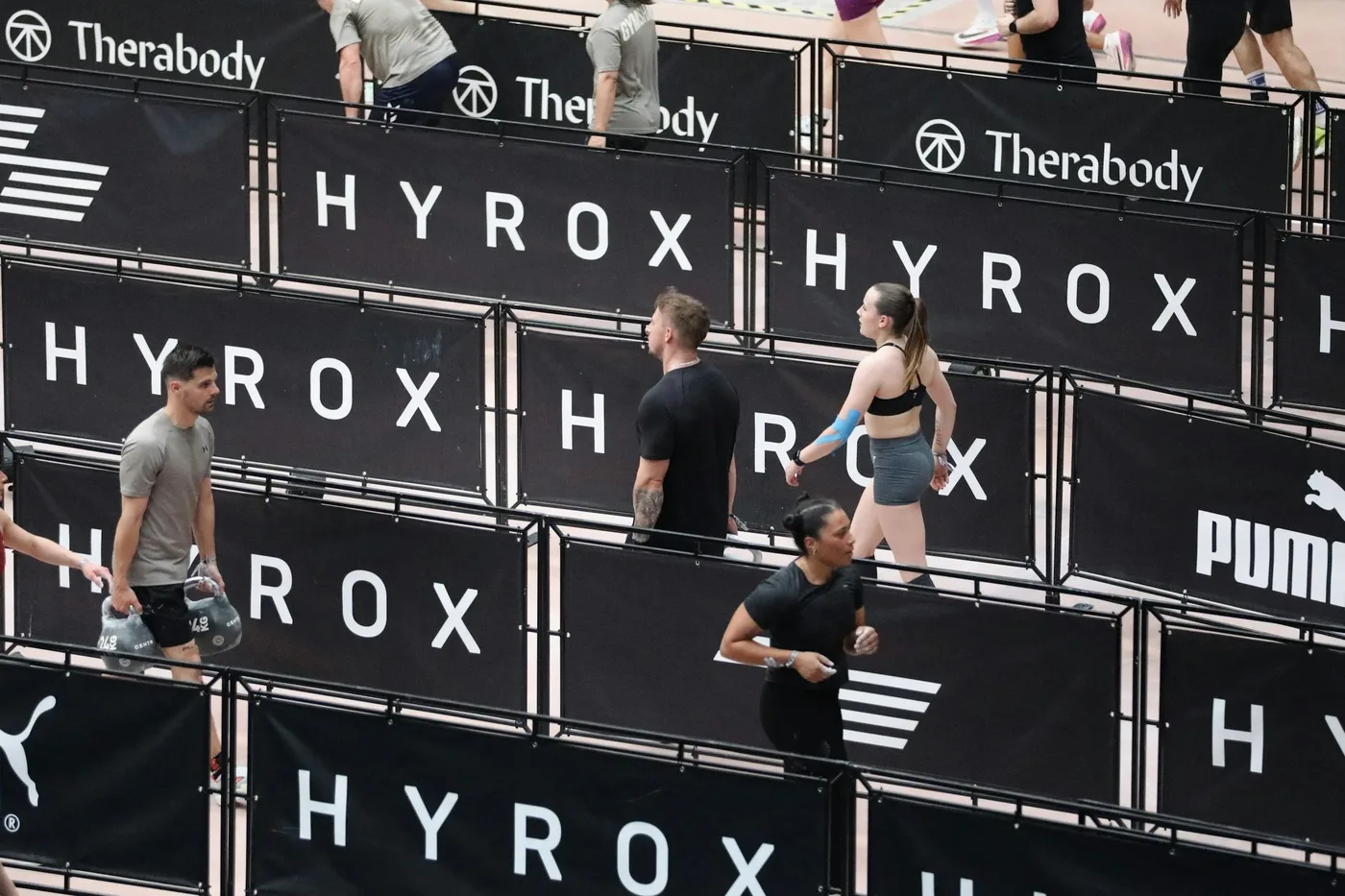 people participating in Hyrax doing kettle bell carries