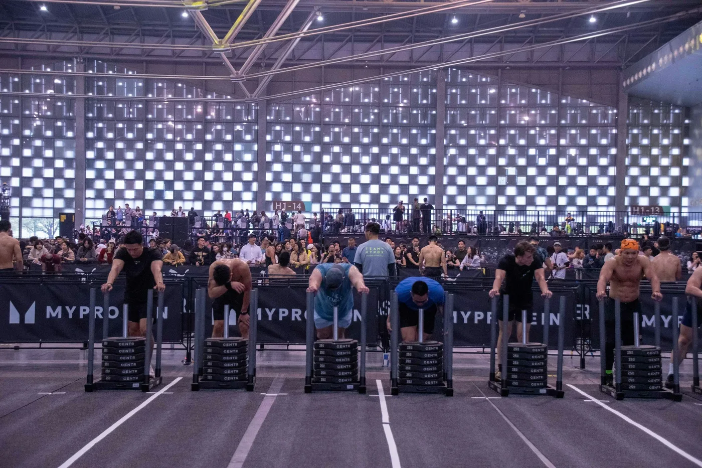 Hyrox athletes doing a sled pull